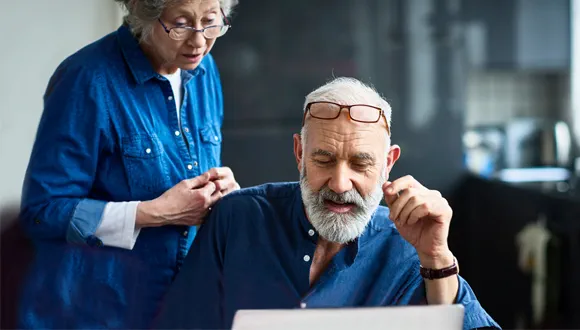 couple looking into laptop